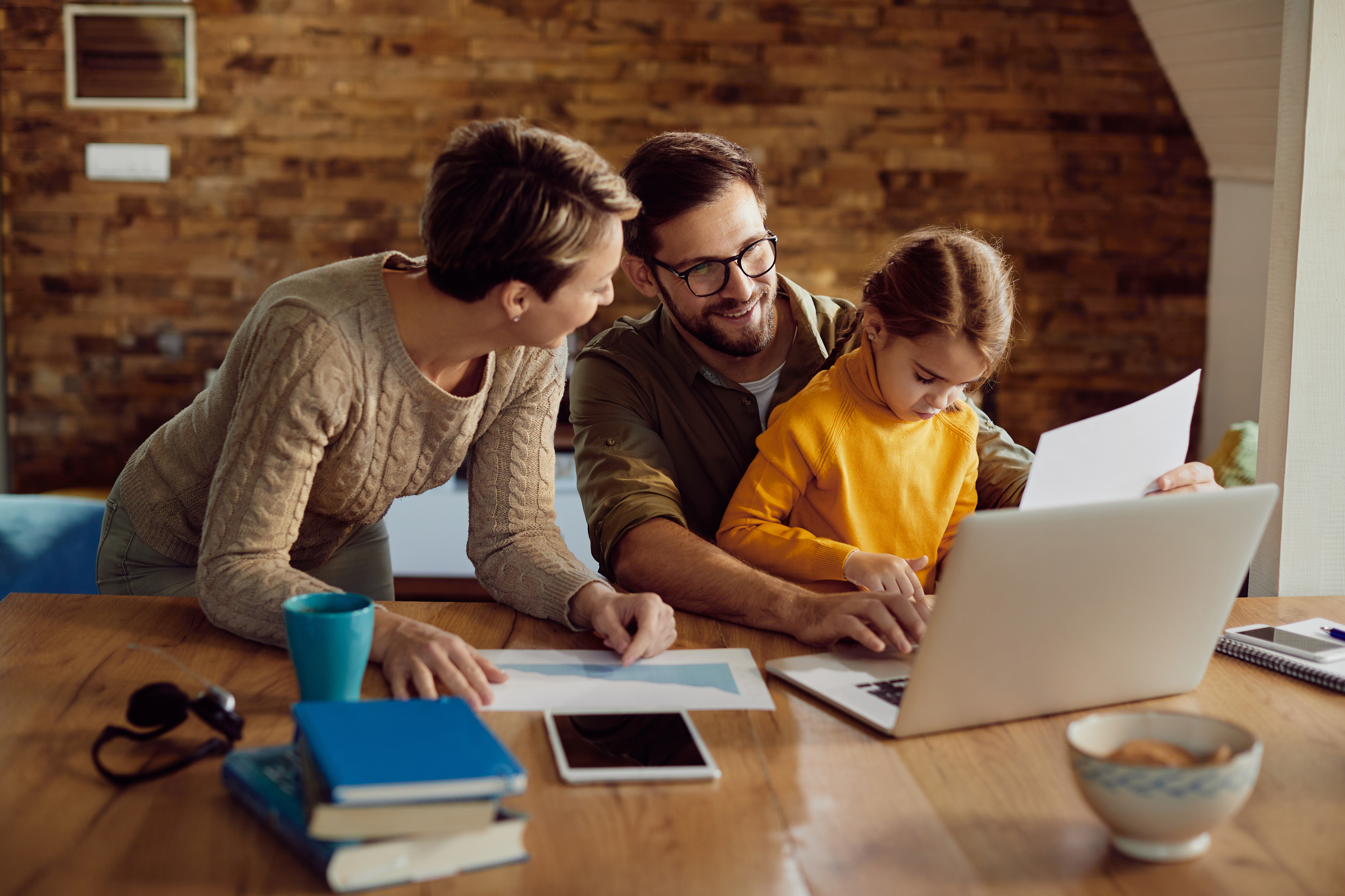 Australian family reviewing home finances together
